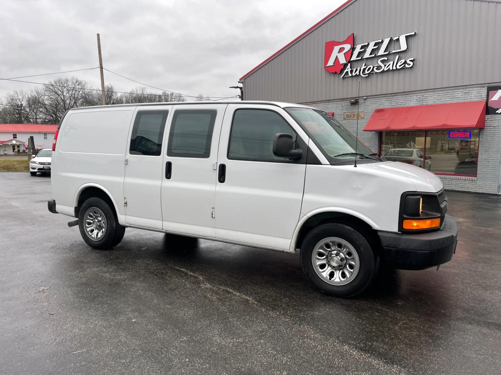 2014 White /Neutral Chevrolet Express 1500 AWD Cargo (1GCSHAF4XE1) with an 5.3L V8 OHV 16V FFV engine, 4-Speed Automatic transmission, located at 547 E. Main St., Orwell, OH, 44076, (440) 437-5893, 41.535435, -80.847855 - This 2014 Chevrolet Express 1500 Cargo Van with a 5.3L Vortec V8 engine and all-wheel drive is a versatile and robust vehicle designed to meet various transportation and towing needs. It comes equipped with convenient features such as power windows, power locks, and a backup camera for safer reversi - Photo #3